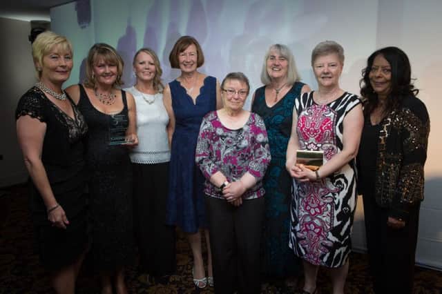 Norma Thirwall presents the Volunteer of the Year award to members of Street Angels South Tyneside.