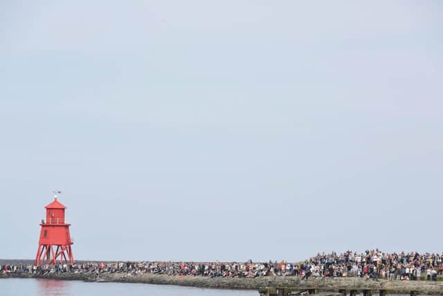 Hundreds turned out to line the south side of the Tyne to see the ship.