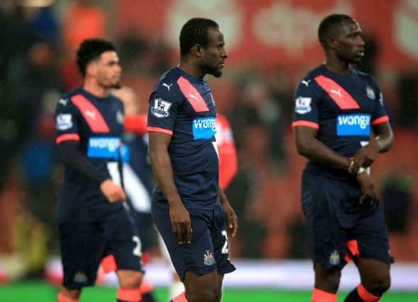 Seydou Doumbia (centre) walks off the pitch dejected after the final whistle at Stoke
