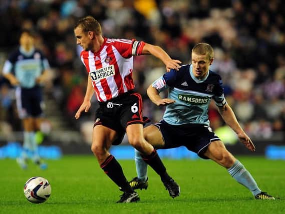 Lee Cattermole in a midfield battle with Grant Leadbitter