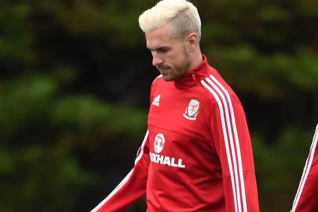 Aaron Ramseys bleached blond style on show during Euro preparations. Pic: PA.