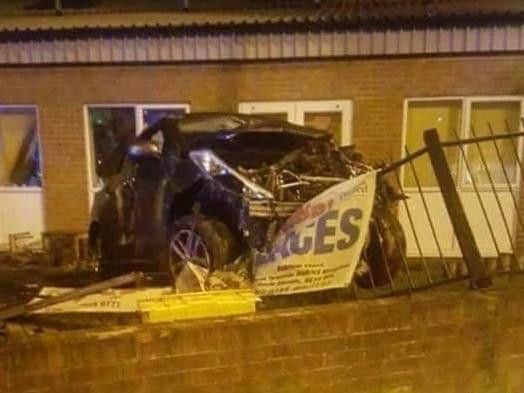 The Nissan car after it crashed through the wall at Ashfield Nursery.