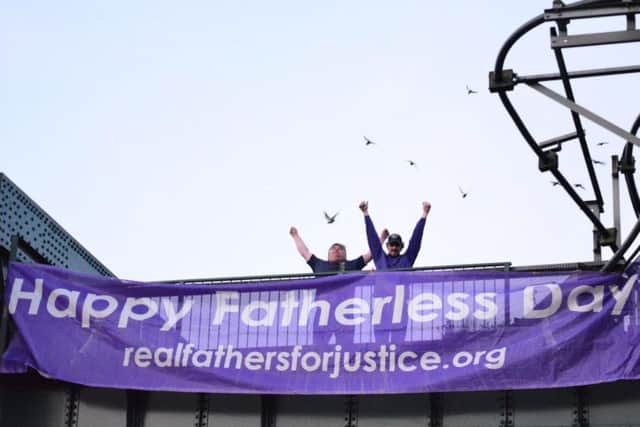 Two dads stage a Father's Day protest on top of the Queen Alexandra Bridge in Sunderland