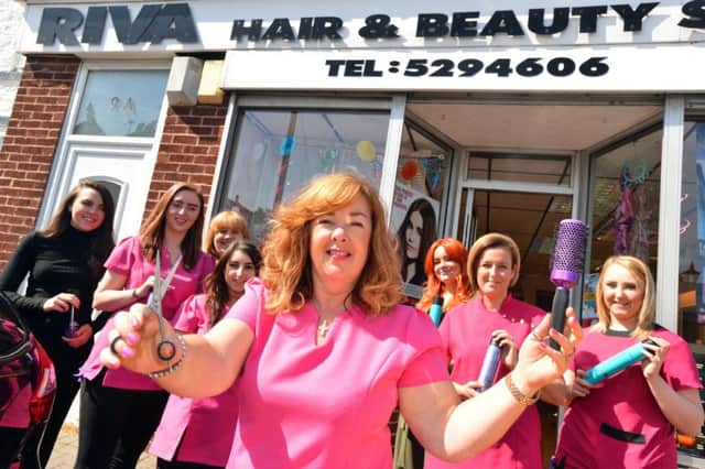Beauty salon Riva celebrates its 20th anniversary.
Owner Carol Richardson-Don with staff