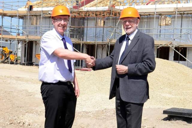 Lea Smith, left, development and regeneration manager for Isos Housing, with Coun Allan West.