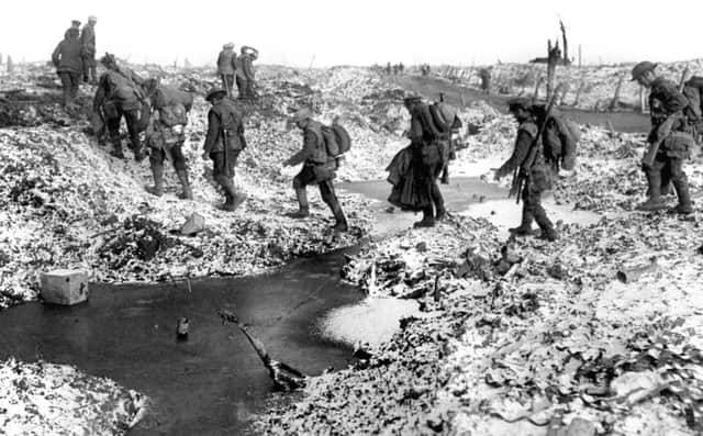 British soldiers negotiating a shell-cratered, Winter landscape along the River Somme
Photo credit should read: PA/PA Wire