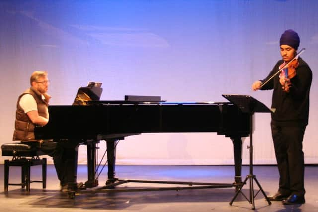 Mortimer Community College pupil violinist Harsev Singh with pianist John Stephenson