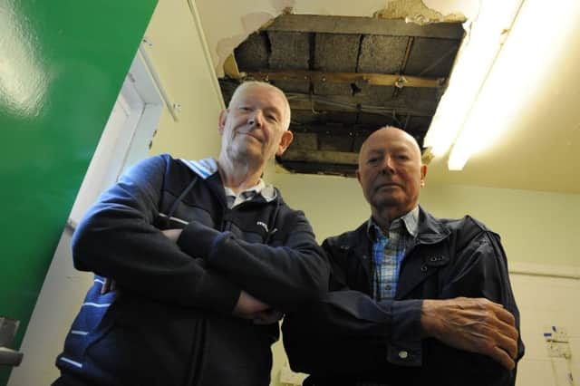 Cleadon Park Bowling Club chairman John Newton, left, and secretary Danny Doran, looking at the damaged roof.