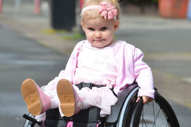 Spina bifida sufferer two year old Rubie O'Brien  receive new special wheelchair with help from Community Corner.
