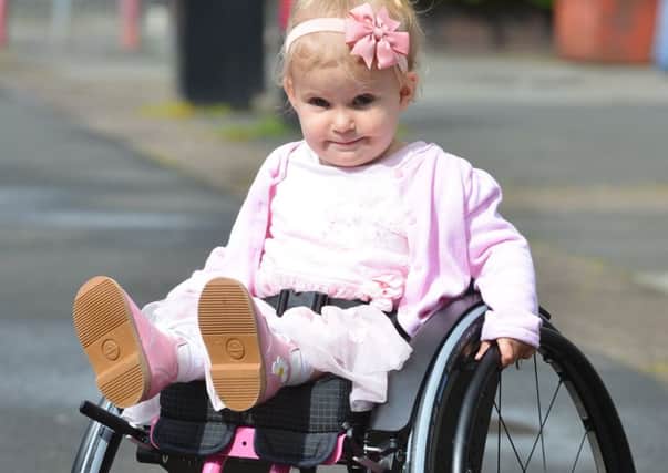 Spina bifida sufferer two year old Rubie O'Brien  receive new special wheelchair with help from Community Corner.