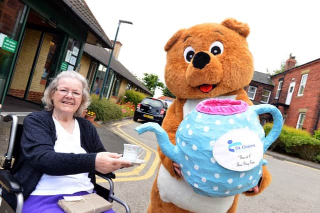 St Clare's Tea at 3 fundraising event. Buddy the bear with Mavis Gaff