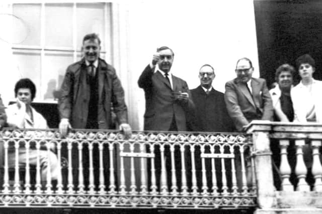 George Brown,  Deputy Leader of the Labour Party, gives a thumbs up sign from the balcony of his hotel to the crowds below at Durham Miners' Gala in 1962.  Next to him, leaning on the balcony, is Anthony Wedgewood Benn.