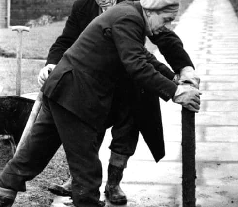 Shields Gazette Memory Lane scanned copy  January 1977 no old ref number   
Two of South Tyneside's paviors at work, John Gibson (left) and Joe Dougal relaying pavements at Redwell Lane, South Shields.