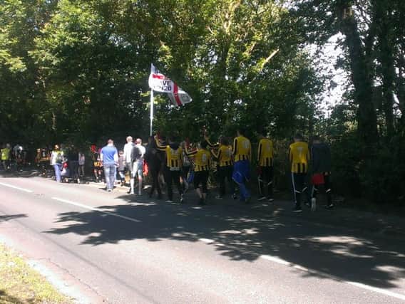 Whitburn and Cleadon junior Football Club marching in Whitburn today to protest over proposals to build houses on the playing fields they use.