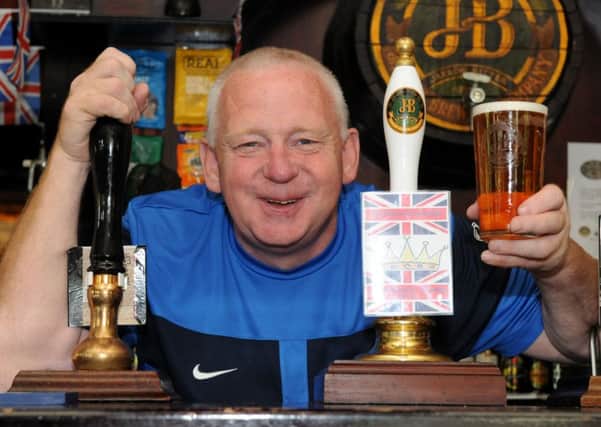Norman Scott behind the bar at The Robin Hood before it closed down.