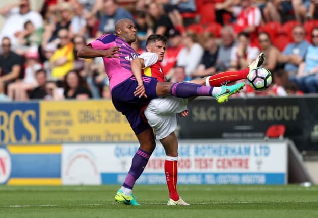 Sunderland's Younes Kaboul and Rotherham United's Jerry Yates battle for the ball.