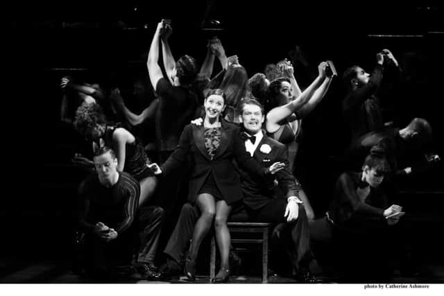 Hayley Tamaddon as Roxie Hart and John Partridge as Billy Flynn in Chicago.