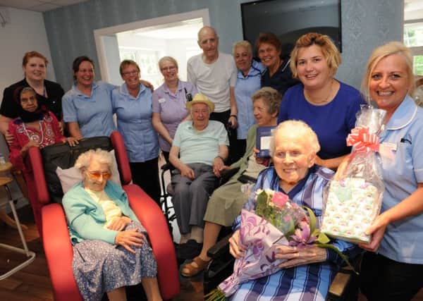 Gwen Purvis celebrates her birthday with staff and fellow residents at Garden Hill Care Home