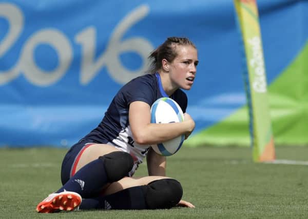Great Britain's Emily Scarratt, looks on after scoring a try during the  rugby sevens match against Canada