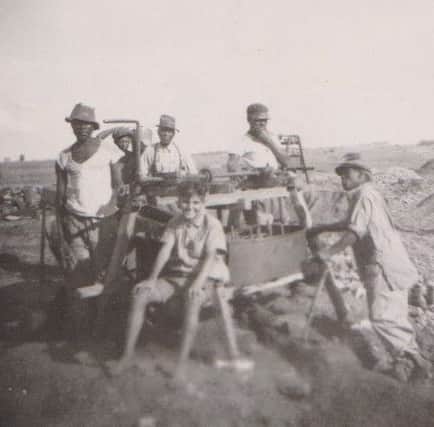 members of Johannes family with workers at a diamond digging.
