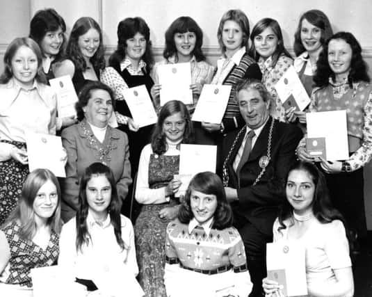 It's October 1974 and here's the   Mayor and Mayoress of South Tyneside, Councillor Murtagh Diamond and Councillor Mrs Elizabeth Diamond, presenting Silver and Bronze Duke of Edinburgh Awards to members of De La Salle Youth Club in St Bede's Hall, South Shields.