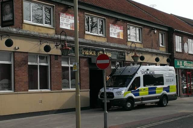 Police outside The Prince Edward pub after the disturbance in which Ronnie Howard died.