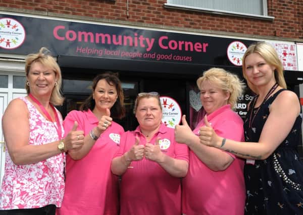 Community Corner founders Lynne Davis, left, and Cheryl McDonald, right, join shop volunteers Gill Albertson, Sheila Tebble, and Annetta Richardson.