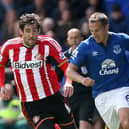 Everton defender Phil Jagielka deals with the threat of Sunderland striker Danny Graham