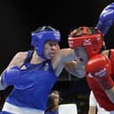 Britain's Savannah Marshall, left and Sweden's Anna Laurell exchange punches