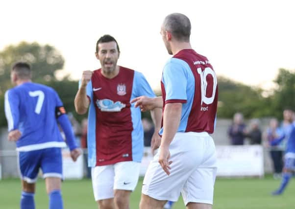Gavin Cogdon is congratulated on his equaliser by Julio Arca. Picture by Peter Talbot