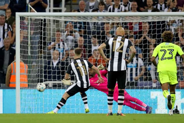 Matt Ritchie scores from the penalty spot against Reading