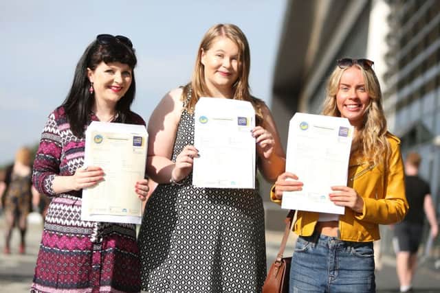 Eleanor Peggie, Courtney Tinnion and Sophie Maccoy are delighted with their marks.
