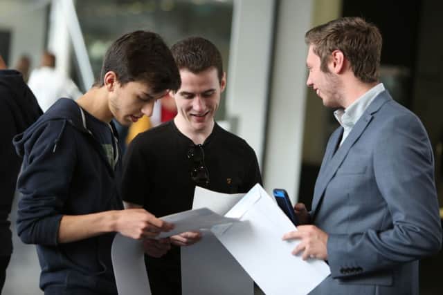 Jack Reay, Damon Shiels-Rowland and Liam Armstrong look at their results.