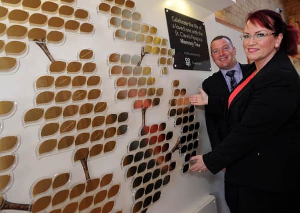 Co-op Funeralcare regional manager David Knowles and South Tyneside manager Dawn Noble with the newly installed Memory Tree at St Clare's Hospice, Jarrow.