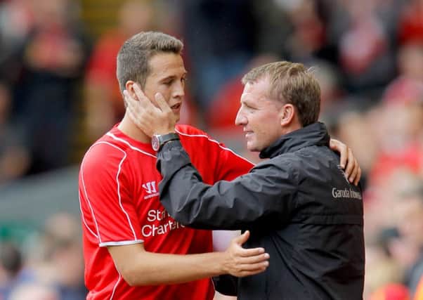 Javier Manquillo with Brendan Rodgers