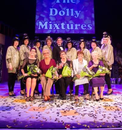 The Dolly Mixtures were invited on stage with the cast to be presented with a liftetime achievement award from Cancer Research.