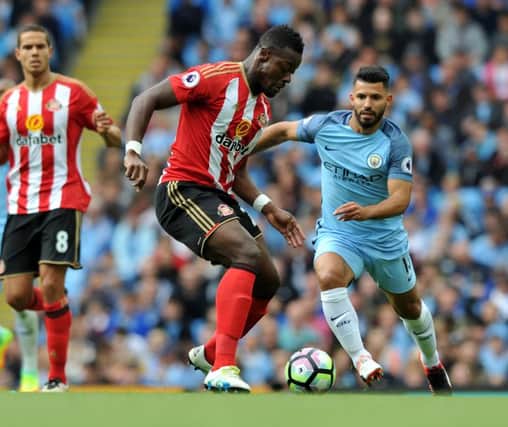 Lamine Kone in action at Manchester City