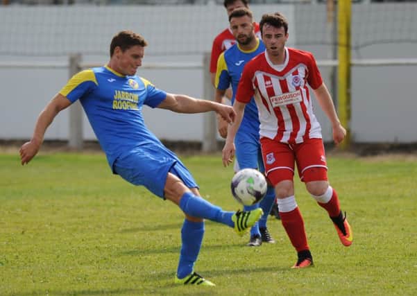 Northern League Football action between Jarrow Roofing FC (blue) v Seaham Red Star, played at Boldon CA Sports Ground.