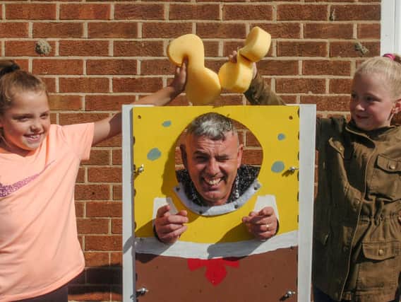 Councillor Lee Hughes spent time in the stocks for his latest family fun day.