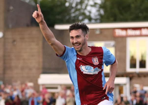 Carl Finnigan celebrates his first goal. Picture by Peter Talbot