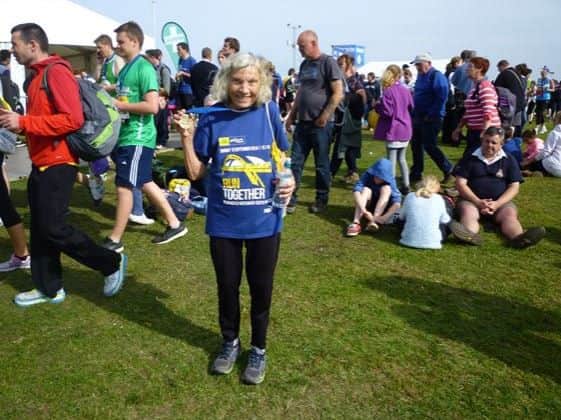 Ruth Anderson celebrating crossing the finishing line of last year's Great North Run.