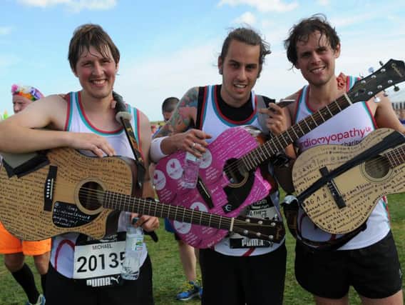 Little Comets, from left Mickey Coles, Matt Hall and Rob Coles, on the Great North Run finish line.