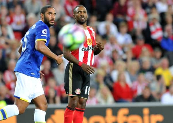 Jermain Defoe and Everton defender Ashley Williams watch a Sunderland shot fly wide in Monday's Stadium of Light clash. Picture by Frank Reid