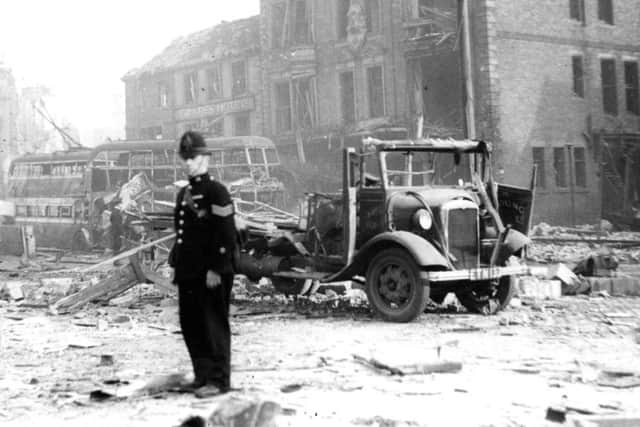 A policeman in the bomb-ravaged Market Place.