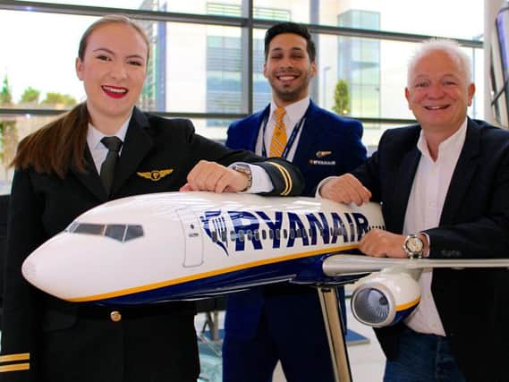 Ryanair Chief People Officer Eddie Wilson, right, with pilot Caitlin Harm and cabin crew Luis Silva, as Ryanair announced the creation of over 3,500 new jobs.
