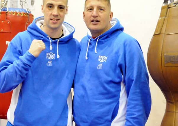 Boxer Tom Whitfield  at Harton & Westoe Welfare Boxing gym with coach Mal Gates (right)