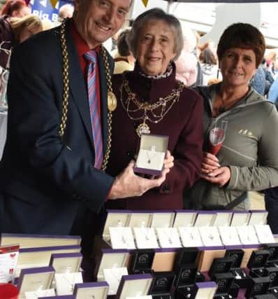 The Mayor and Mayores South Tyneside, Councillor Alan and Councillor Moira Smith, helping out on the Bling and Buy stall with Liz Potts