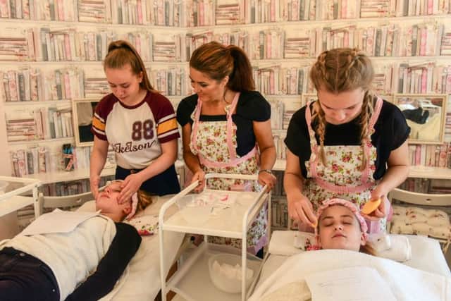 Caroline Ormston (left) who has opened Feminie Grace Beauty Salon & Parlour, Prince Consort Road, Hebburn watches Bayleigh Oliver (14) working on Natasha Thorpe (12) and Molly McGuire (14) with Beth Scott (12)