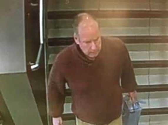 Image of a man police want to speak to in connection with criminal damage at McDonalds in King Street