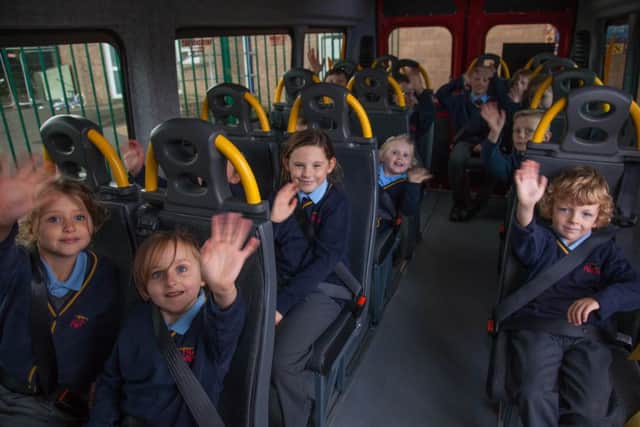 St Aloysius pupils enjoy their new minibus.